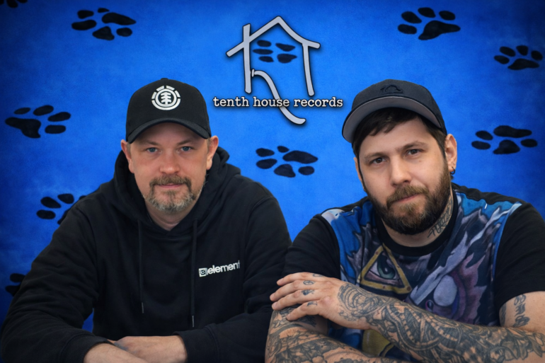 tenth house records on blue background with black paw prints